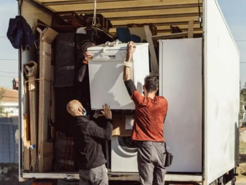 Appliances loaded and secured on the Freedom Junk Removal truck