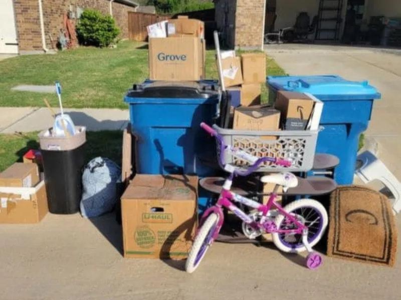 Boxes staged curbside ready for Freedom Junk Removal pickup