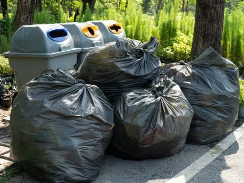 Pile of bagged trash staged for removal in Johnson County